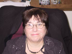 White female with glasses and short brown hair