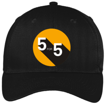 A black baseball cap featuring the 5 for 5 logo: a burnt yellow circle shows the text "5 for 5" in white. The text casts a black shadow that extends to the right edge of the circle. 